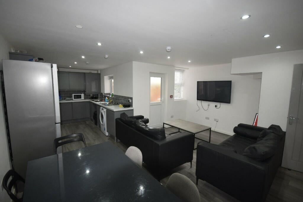 A spacious and modern living room perfect for s...