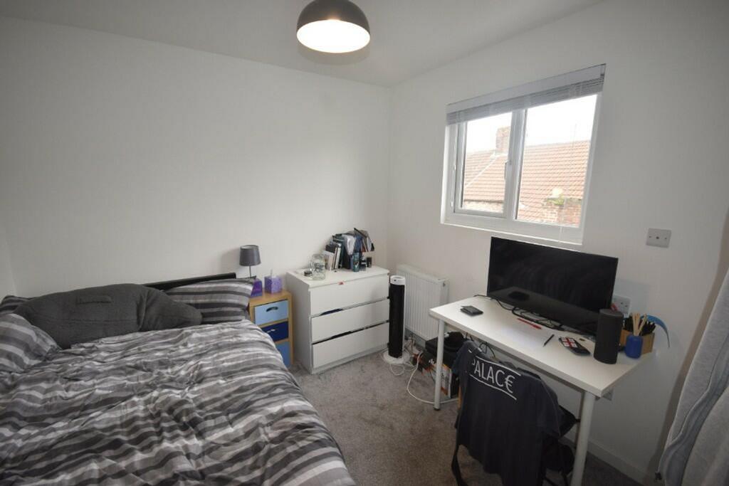 A bright and tidy double bedroom with a comfort...