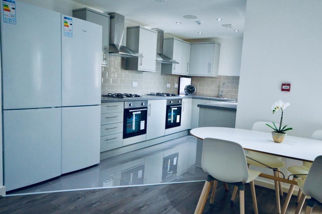 A spacious and modern kitchenette with sleek ap...