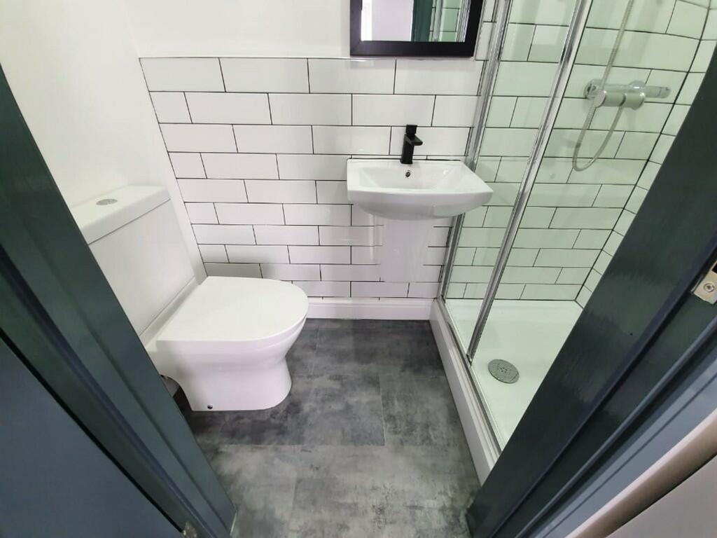 A clean and modern bathroom featuring a spaciou...