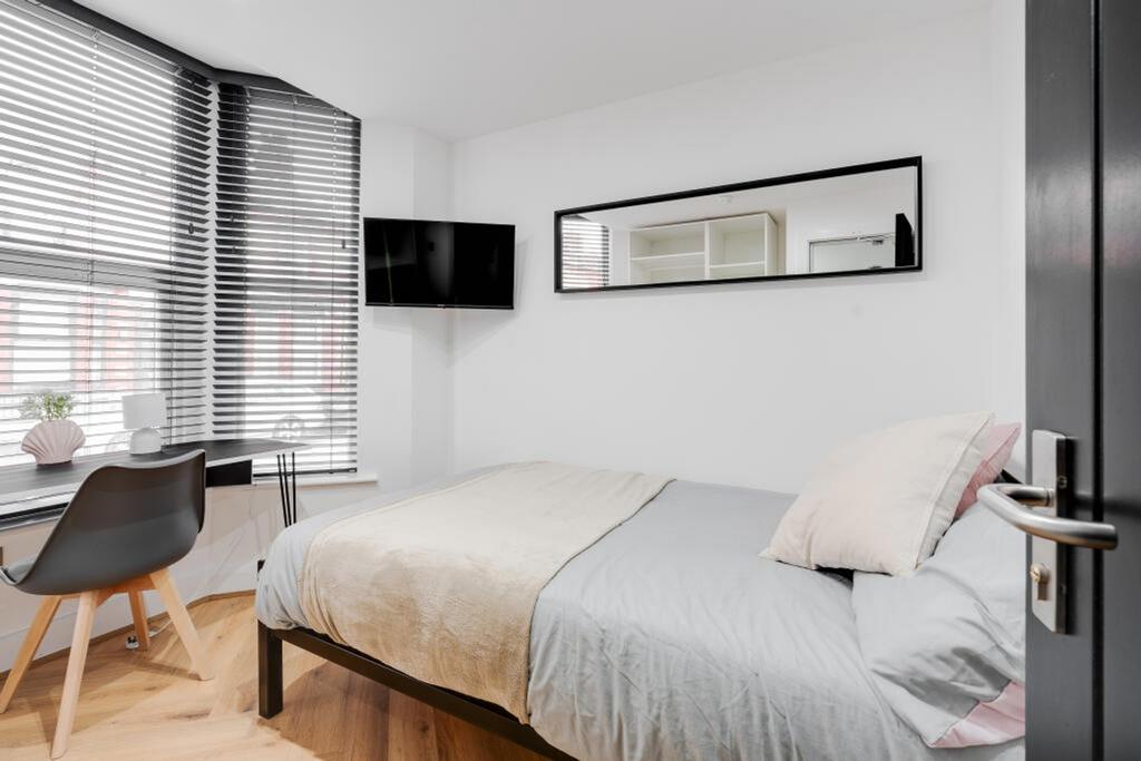 This cozy double bedroom features stylish decor...