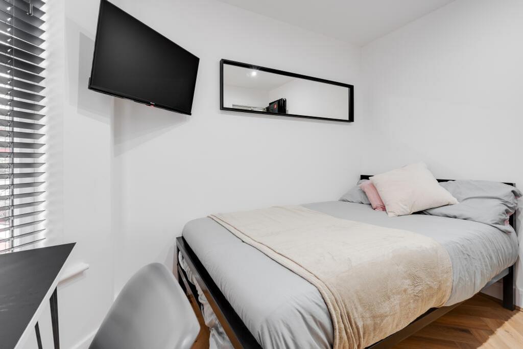 This stylish double bedroom offers a cozy retre...