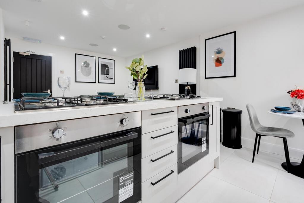 A modern kitchen featuring sleek appliances, am...