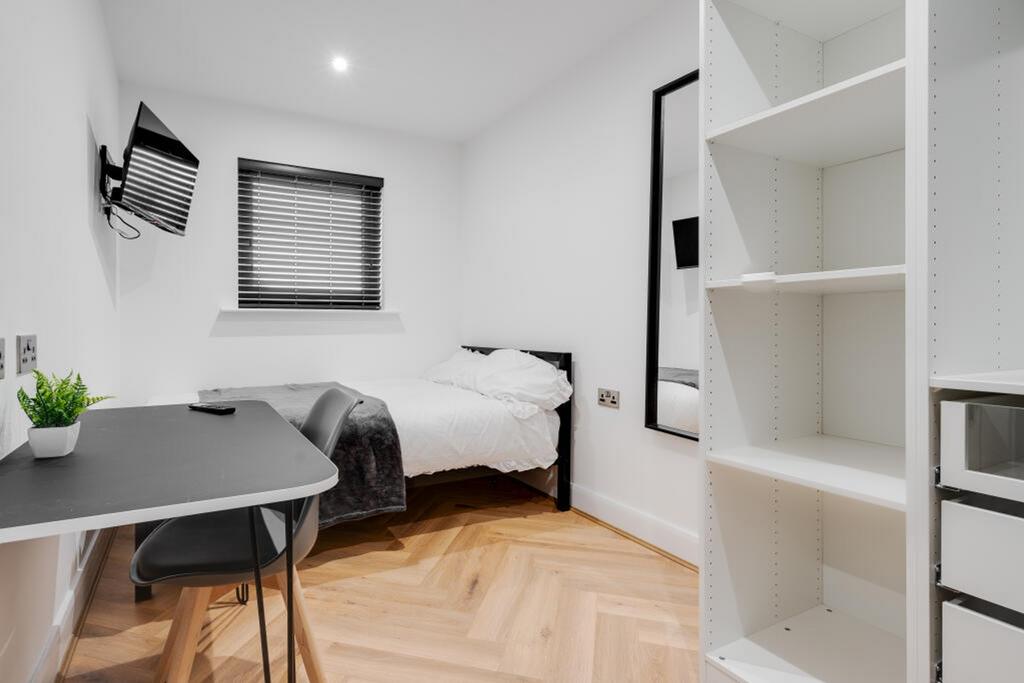 A stylish double bedroom featuring a comfortabl...