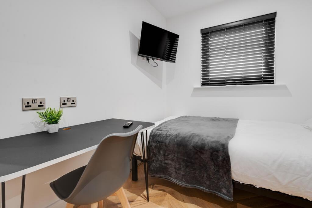 A stylish double bedroom featuring a comfortabl...