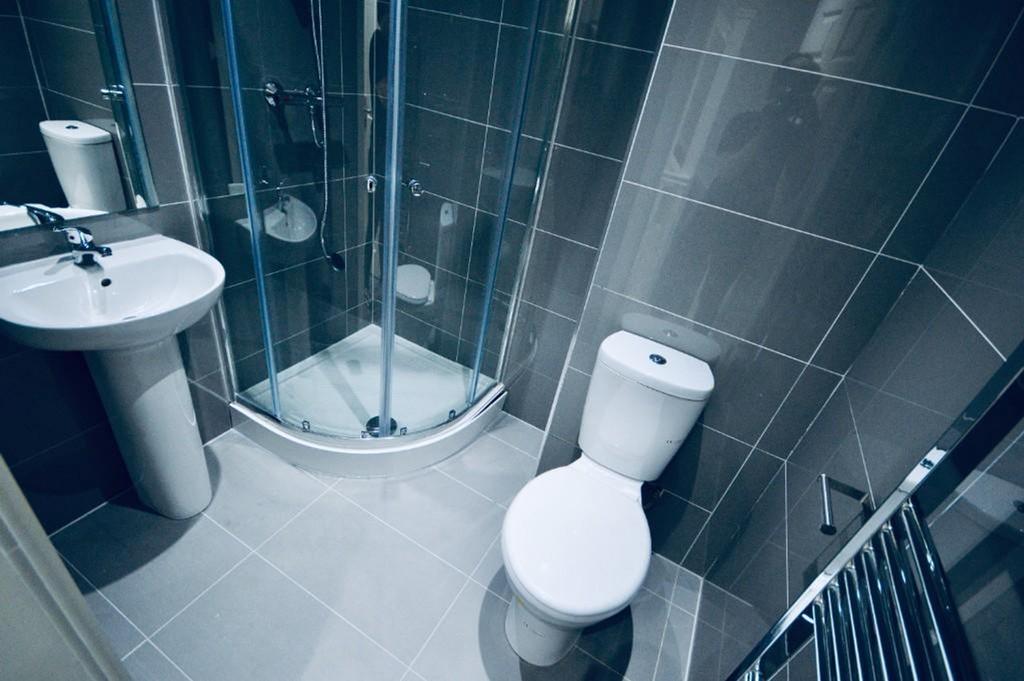 A modern and clean bathroom featuring a sleek d...