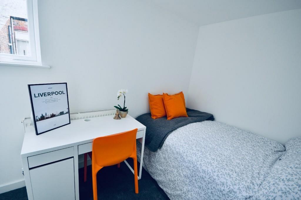 A bright and inviting double bedroom featuring ...