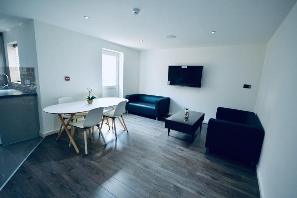 A spacious and contemporary living room perfect...