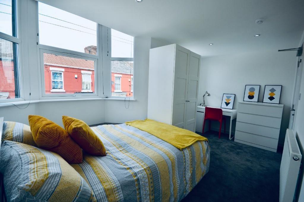 A bright and inviting double bedroom featuring ...