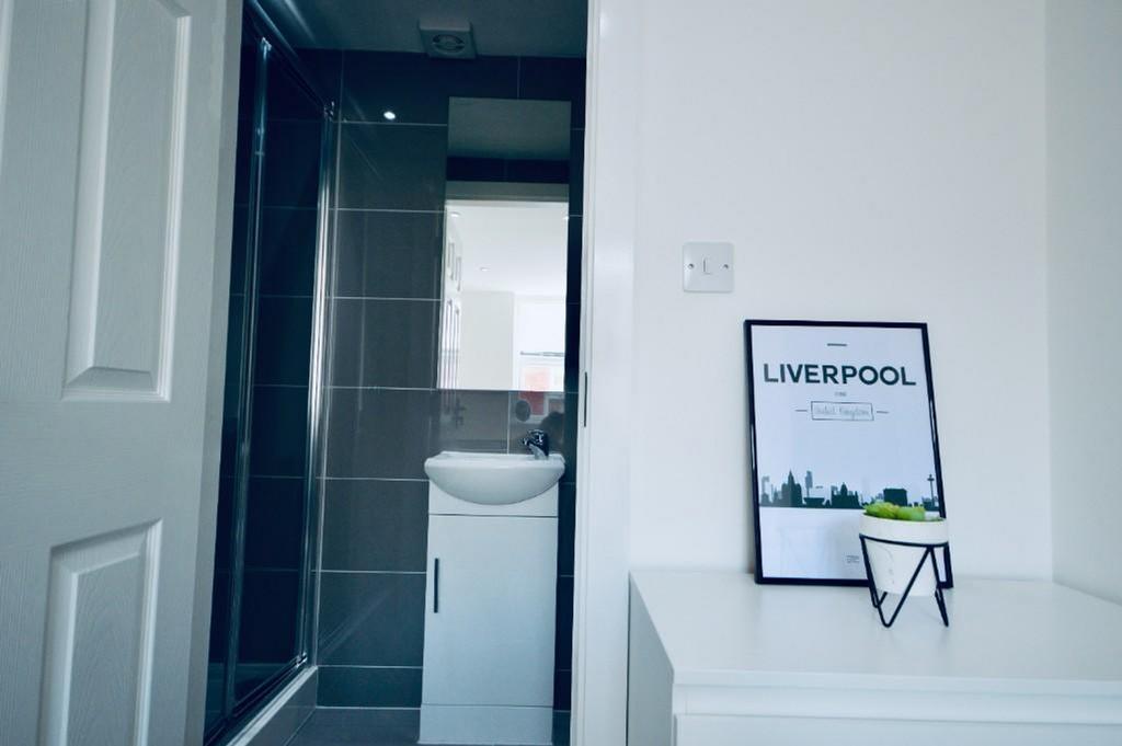 A modern and clean bathroom with sleek fixtures...