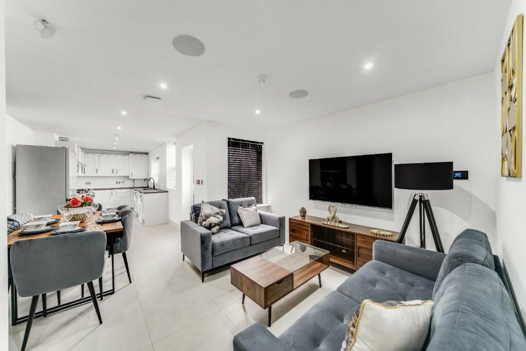 A stylish and modern living room featuring ampl...