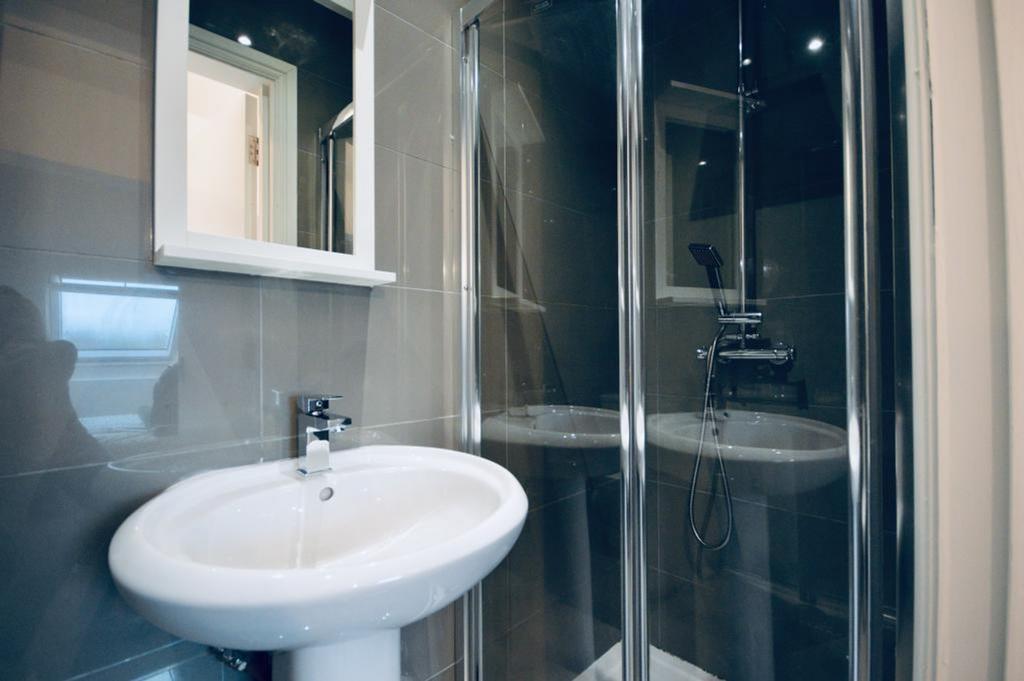 A modern and clean bathroom featuring a spaciou...