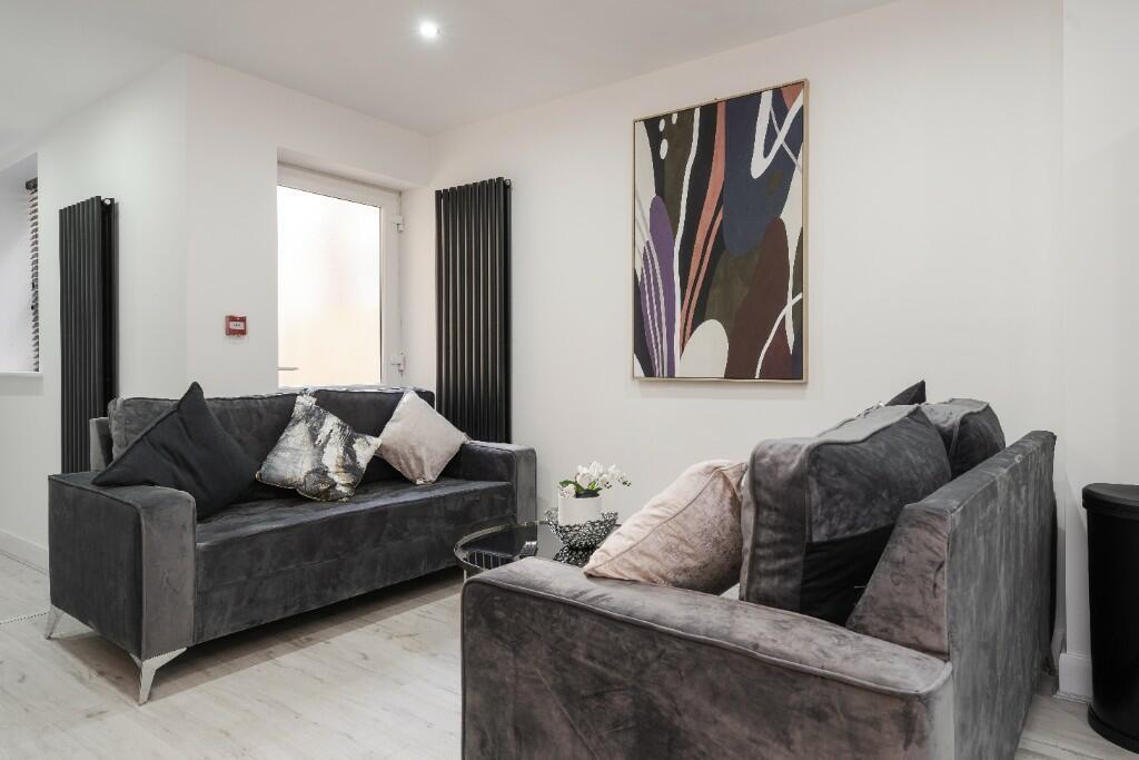 Stylish living room featuring contemporary deco...