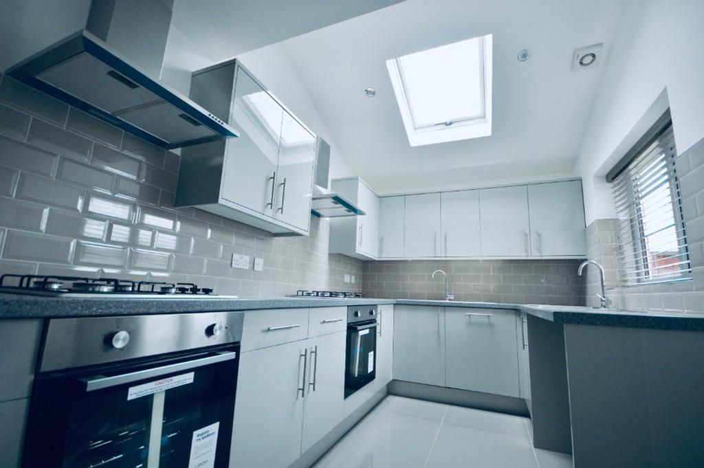 A modern and spacious kitchen filled with natur...