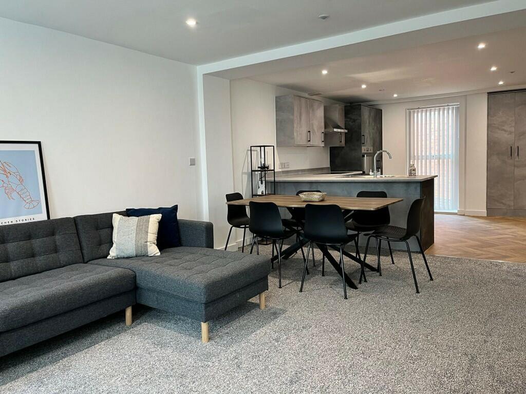 A spacious and modern living room with a cozy l...