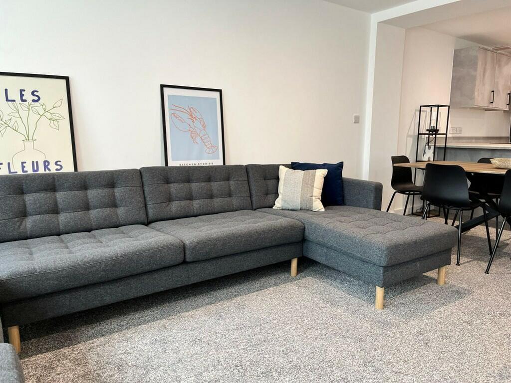 A spacious and stylish modern living room perfe...
