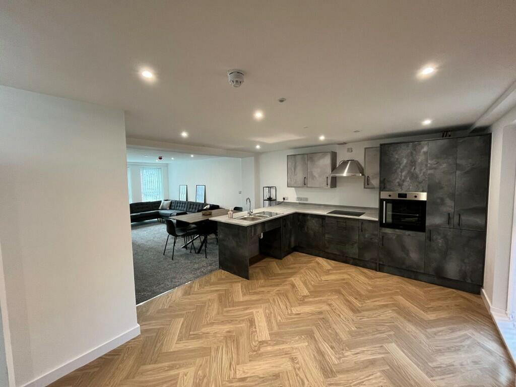 A modern and spacious kitchen with stylish fini...