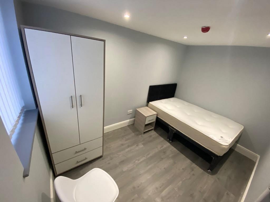 Spacious double bedroom featuring a comfortable...