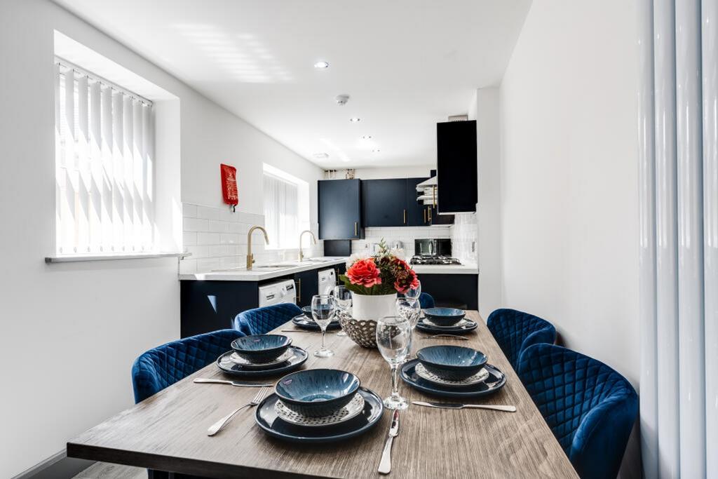A modern and stylish kitchenette with ample nat...