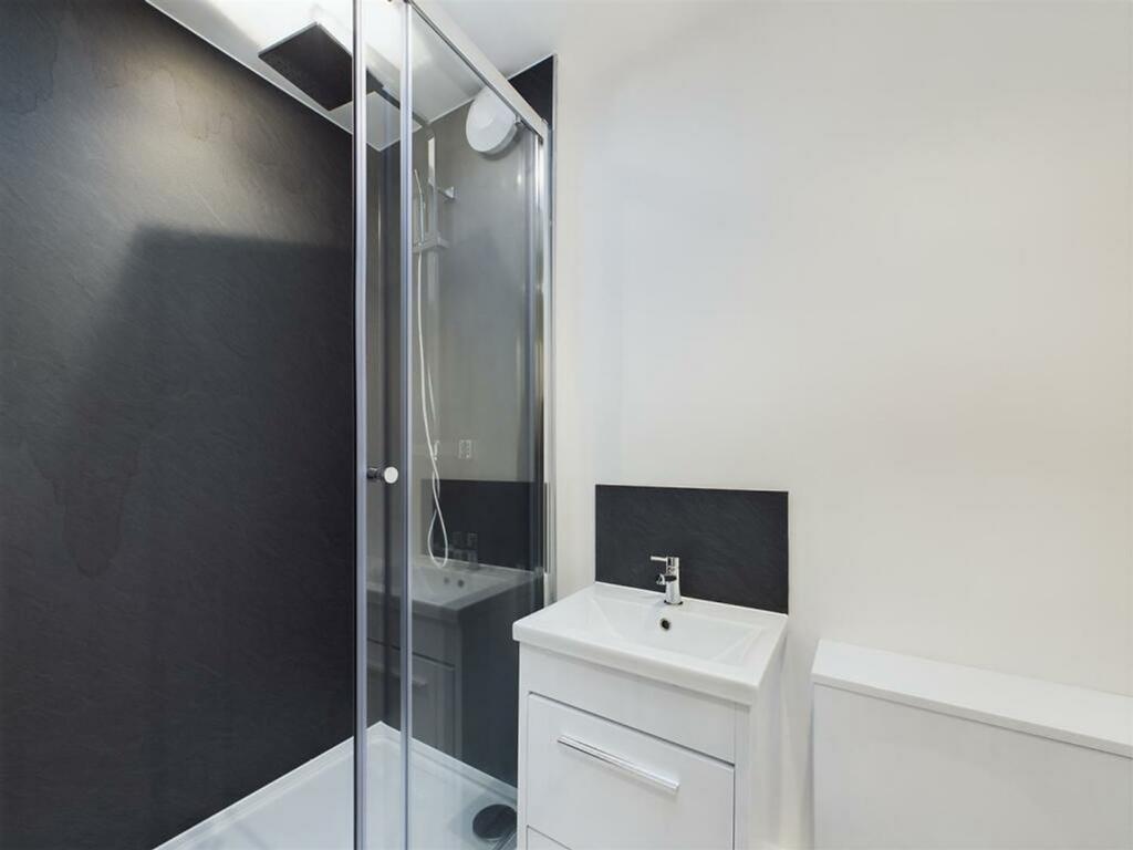 A modern and stylish bathroom featuring a sleek...