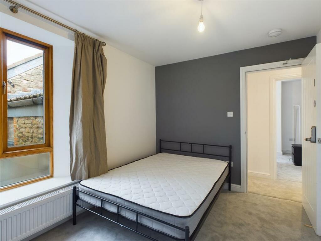 A bright and spacious double bedroom featuring ...