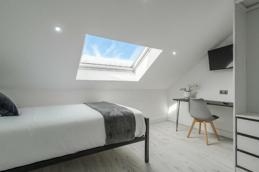 Bright and airy double bedroom featuring a spac...
