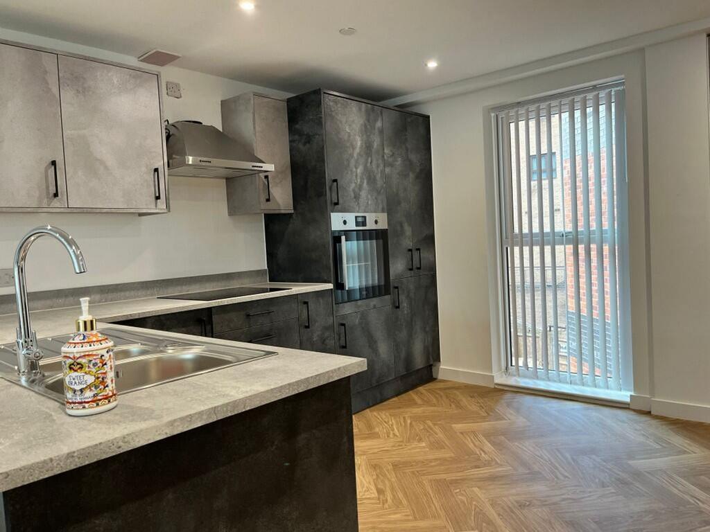 A modern and stylish kitchenette featuring ampl...
