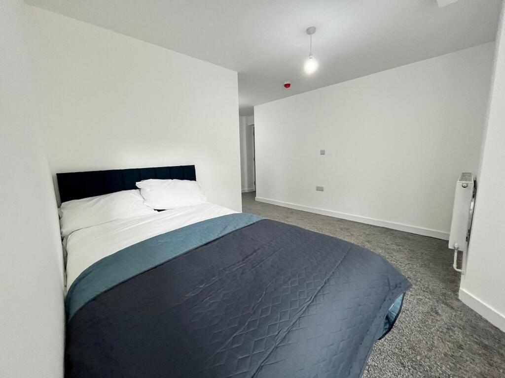 A spacious and inviting double bedroom, perfect...