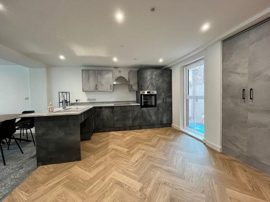 A modern and spacious kitchen featuring stylish...
