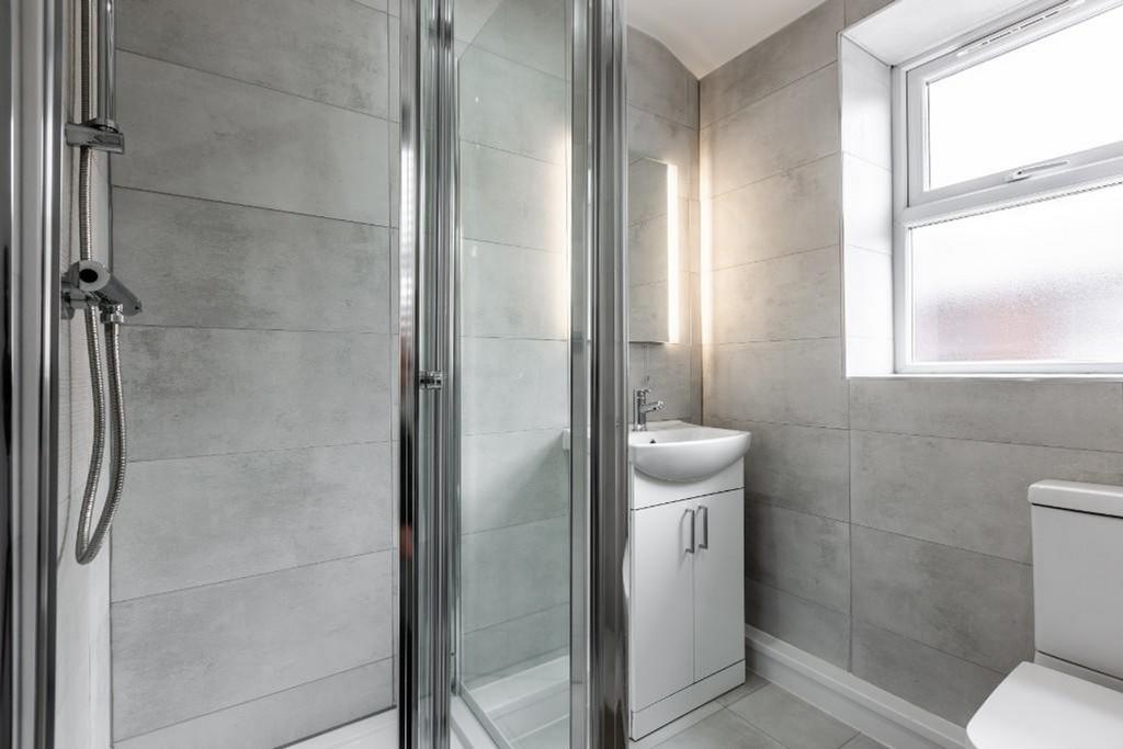 A modern and clean bathroom featuring a stylish...