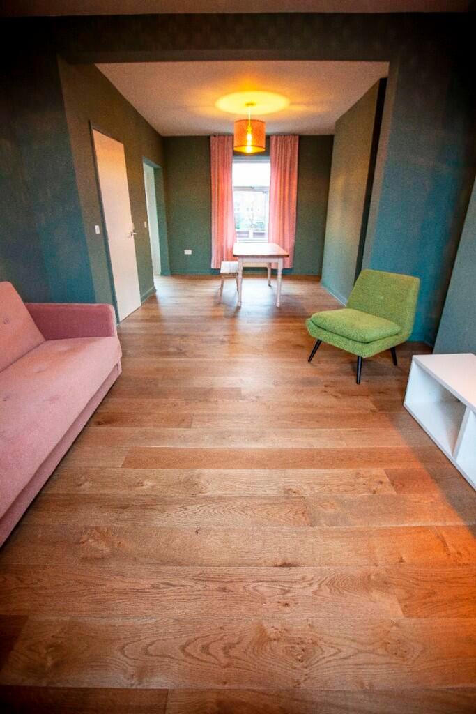 A spacious and stylish modern living room with ...
