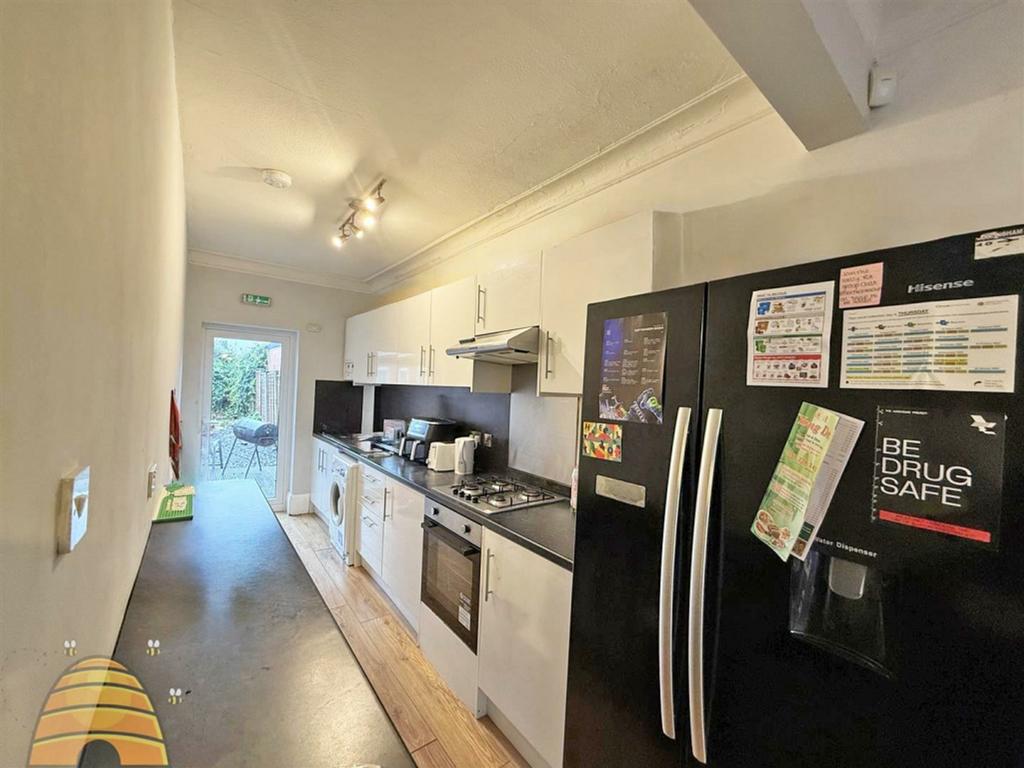 A bright and clean kitchenette with modern appl...