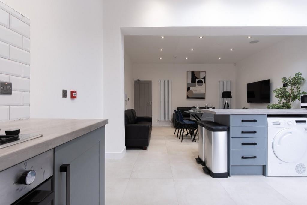 Modern kitchen featuring sleek cabinetry, ample...