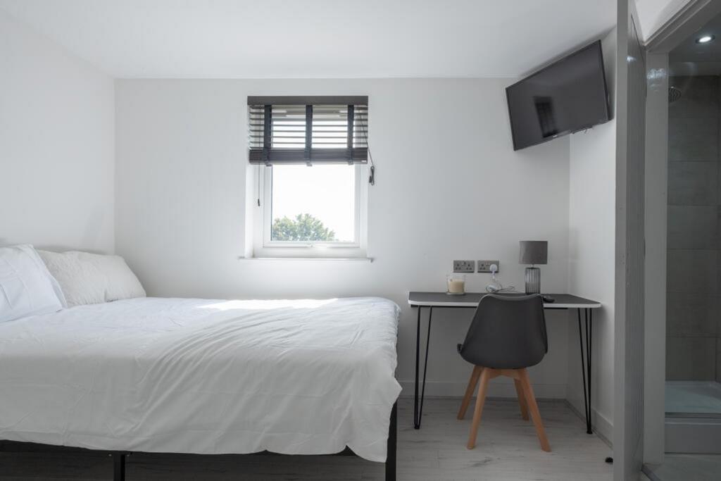 This inviting double bedroom features a comfort...