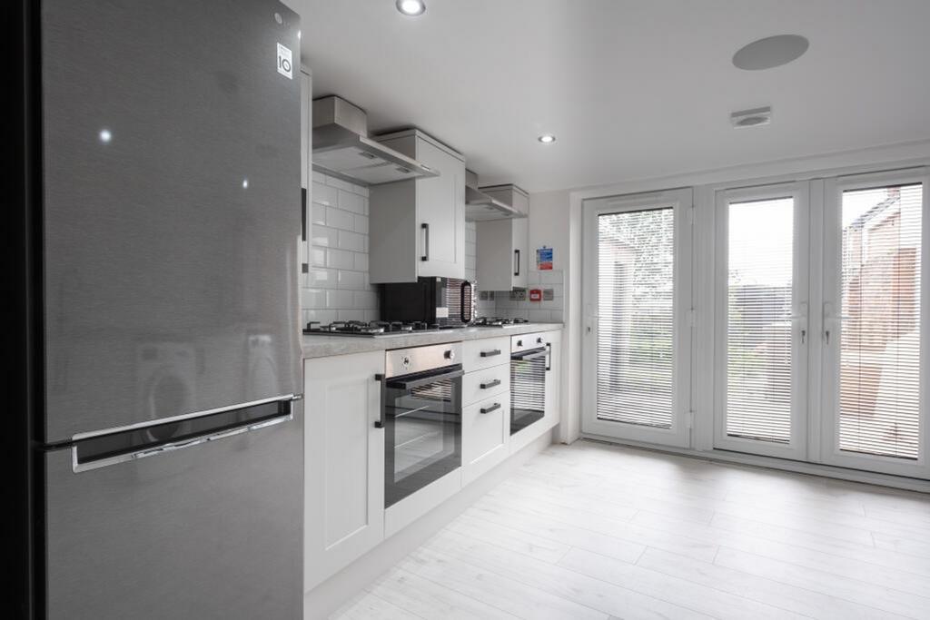 Stylish kitchen featuring modern appliances and...