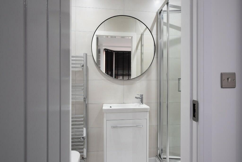 Contemporary bathroom featuring a sleek design ...