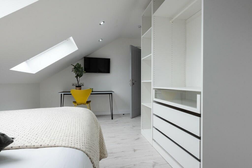 Modern double bedroom featuring ample storage, ...