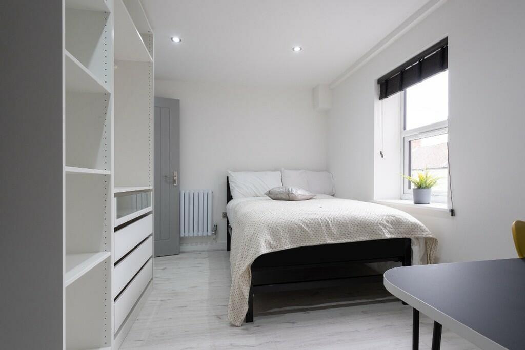 Bright and inviting double bedroom featuring a ...