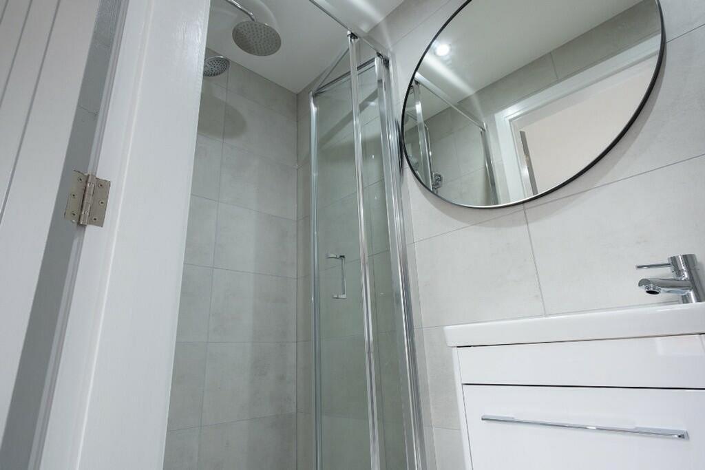 Modern bathroom featuring a sleek design with a...