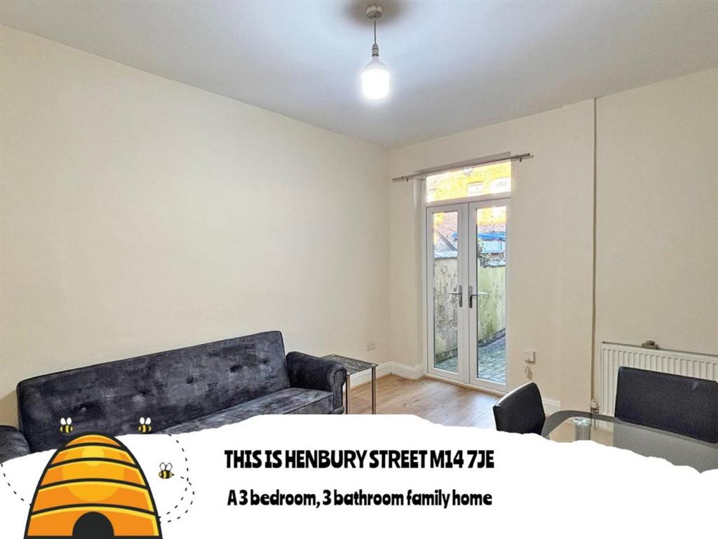 A bright and tidy living room featuring a comfo...