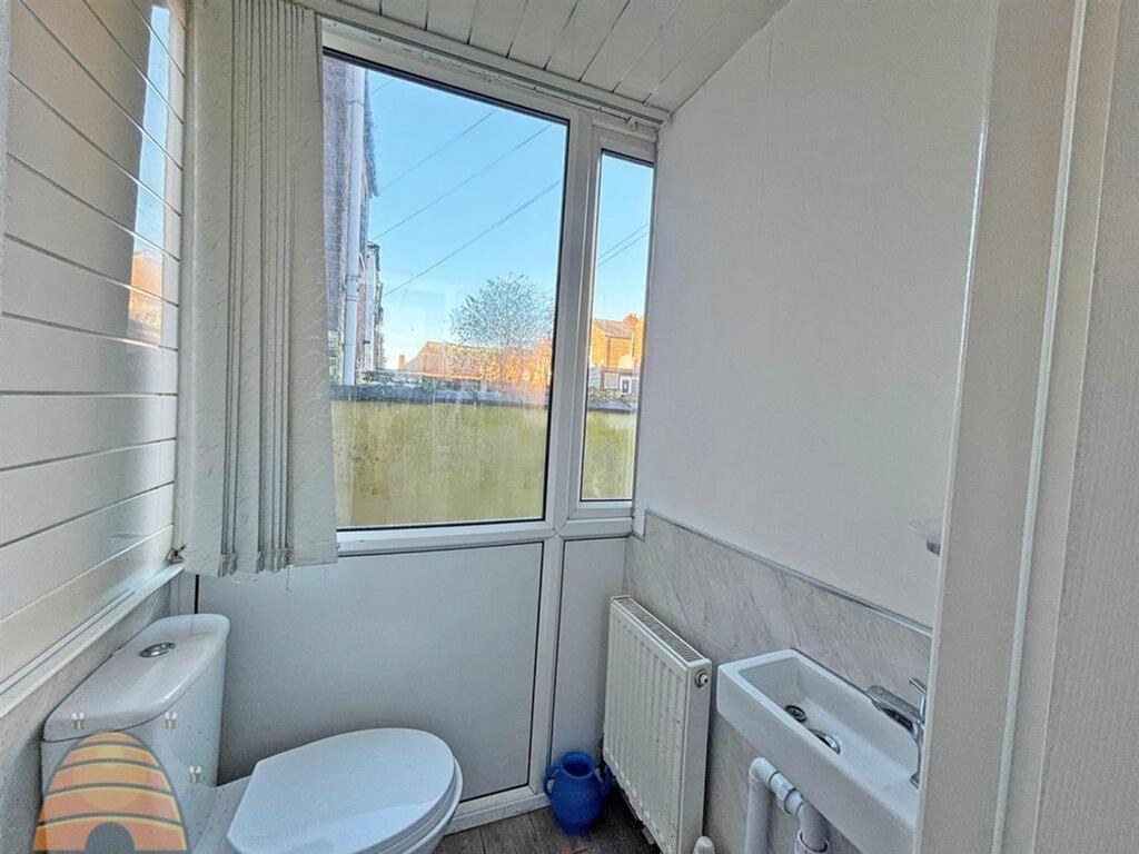A tidy and well-maintained single toilet with n...