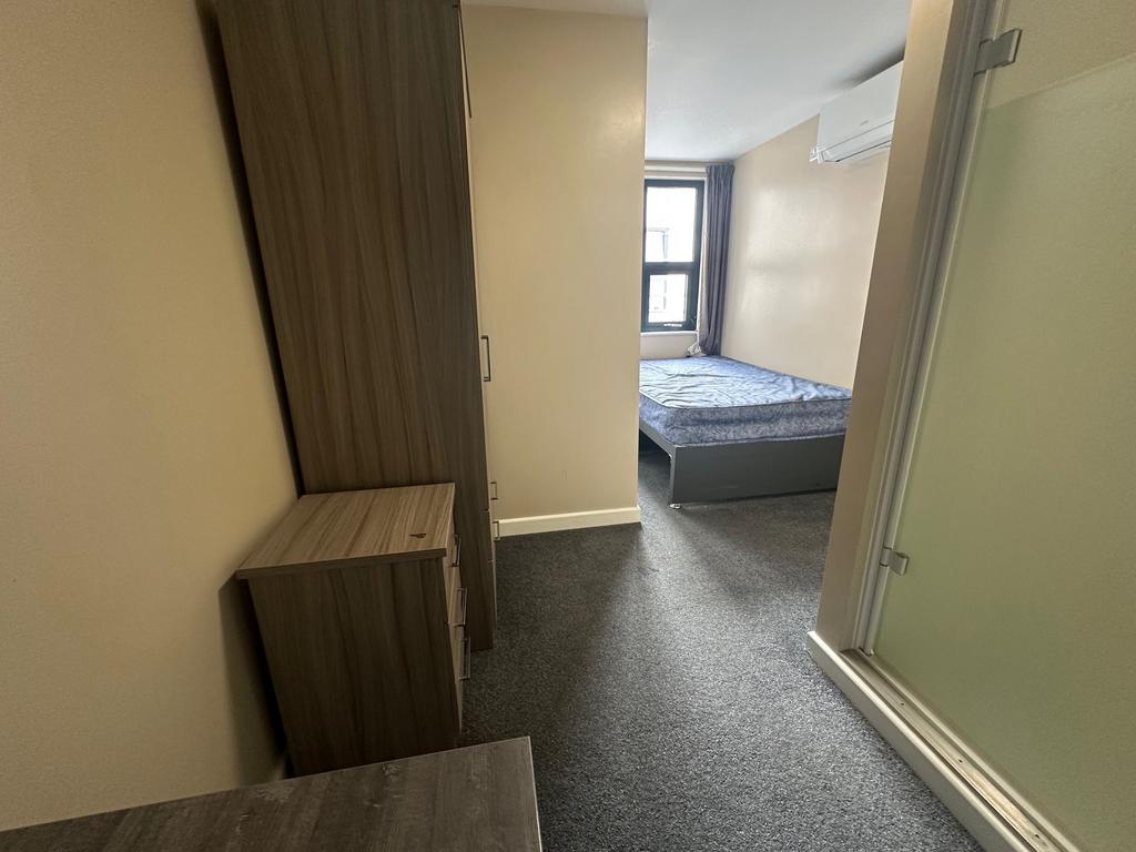 Well-presented furnished bedroom with a double ...