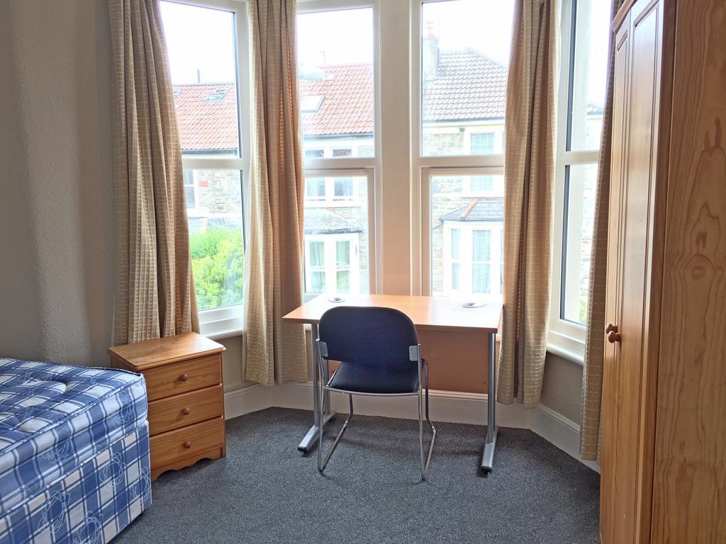 Bright and inviting double bedroom featuring a ...