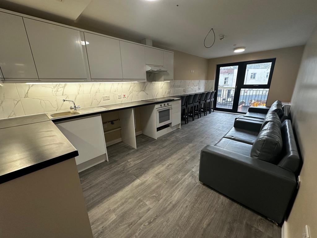 Modern kitchen space with sleek cabinetry and a...