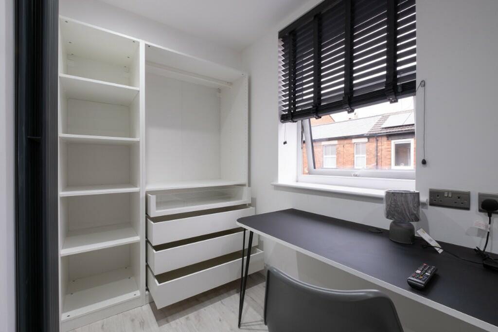 This well-organized communal workspace features...
