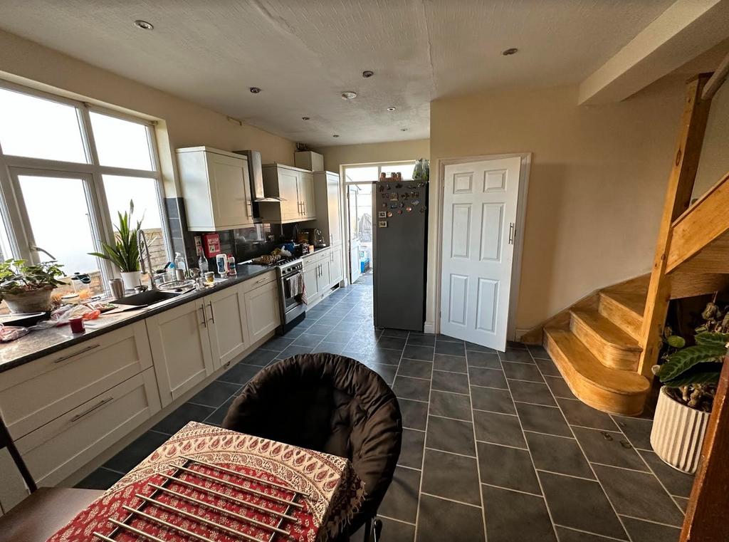 A spacious kitchen with good natural light, fea...