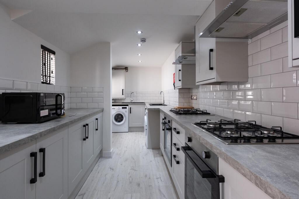 Stylish and modern kitchen featuring sleek cabi...