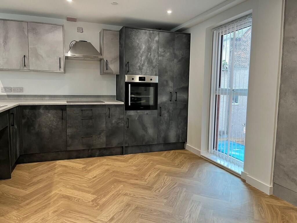 Modern kitchen featuring sleek cabinetry and am...