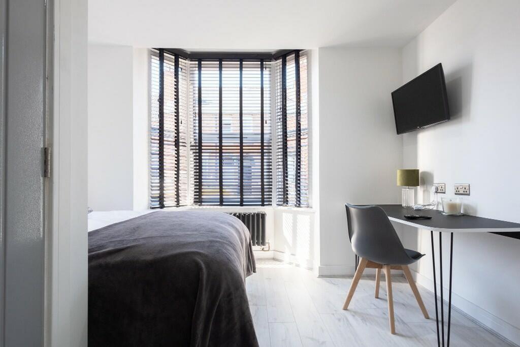 A beautifully designed double bedroom featuring...