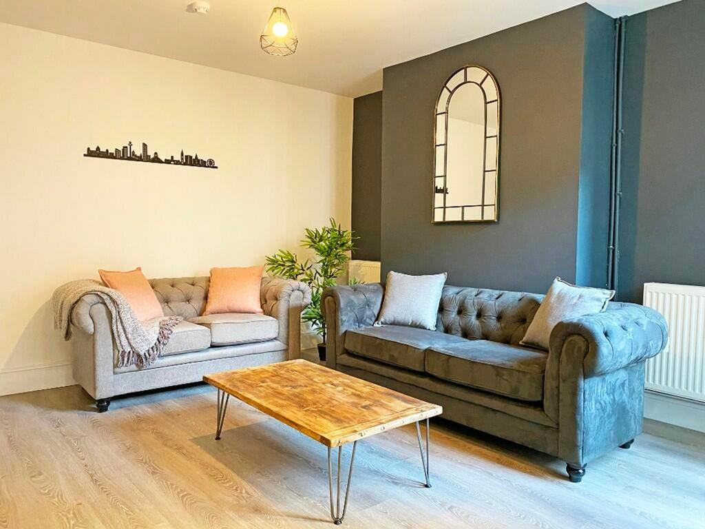 A stylish and spacious modern living room, perf...